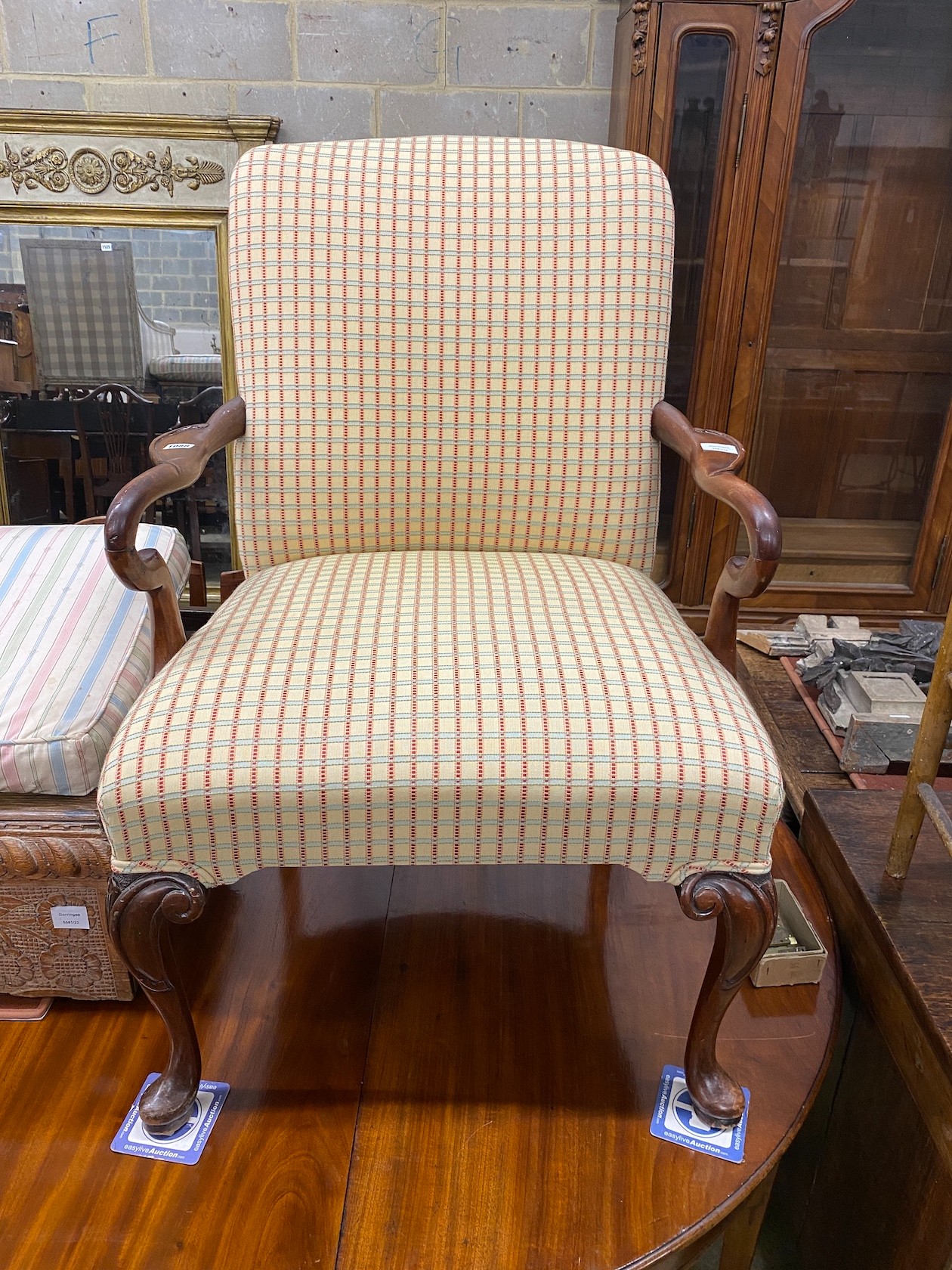 A George II style mahogany upholstered open armchair